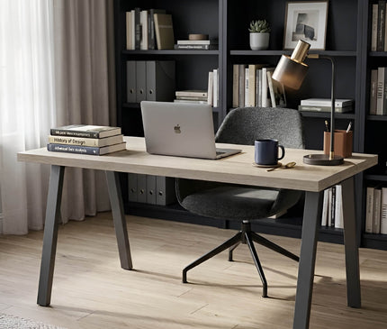 Modern home office with a desk, chair, laptop, and books.