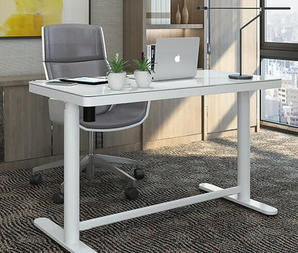 Glass top white standing desk in a modern office setting